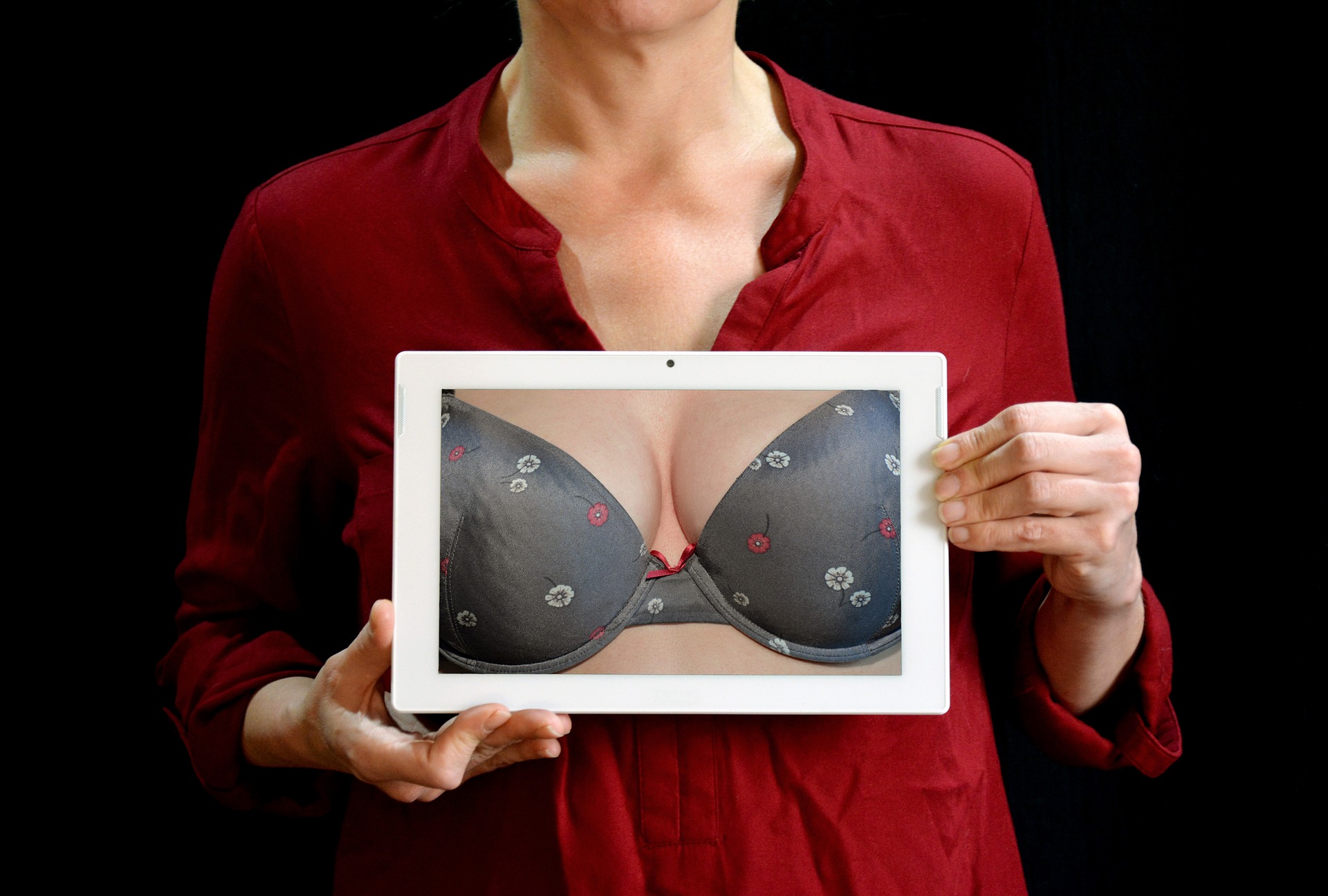 lady holding a tablet with breast image
